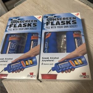 Two nwt packages of flasks disguised as sunscreen
